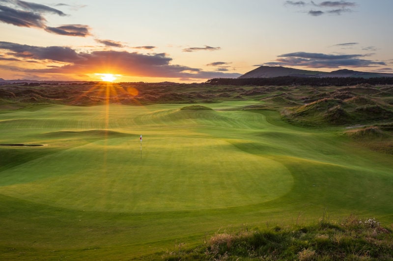 Dumbarnie low sunset behind green